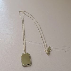 Melinda Maria Gold necklace, with tag charm.